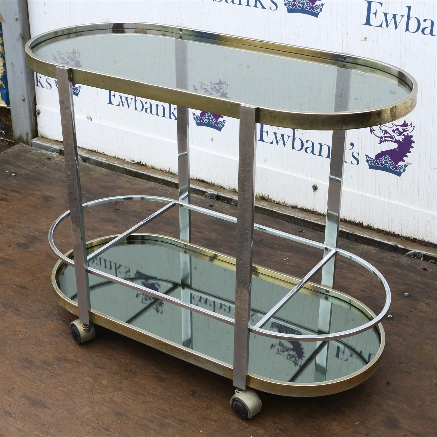 Unknown Designer, a chromed metal bar trolley, with glass top, above mirrored base, on casters, - Image 3 of 5