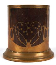 Earhard and Sohne, a polished brass and rose bottle coaster or desk tidy, the brass cut in floral