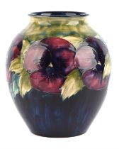 William Moorcroft (British, 1872 - 1945) for Moorcroft, ovoid shaped vase in Pansy pattern, c1920,