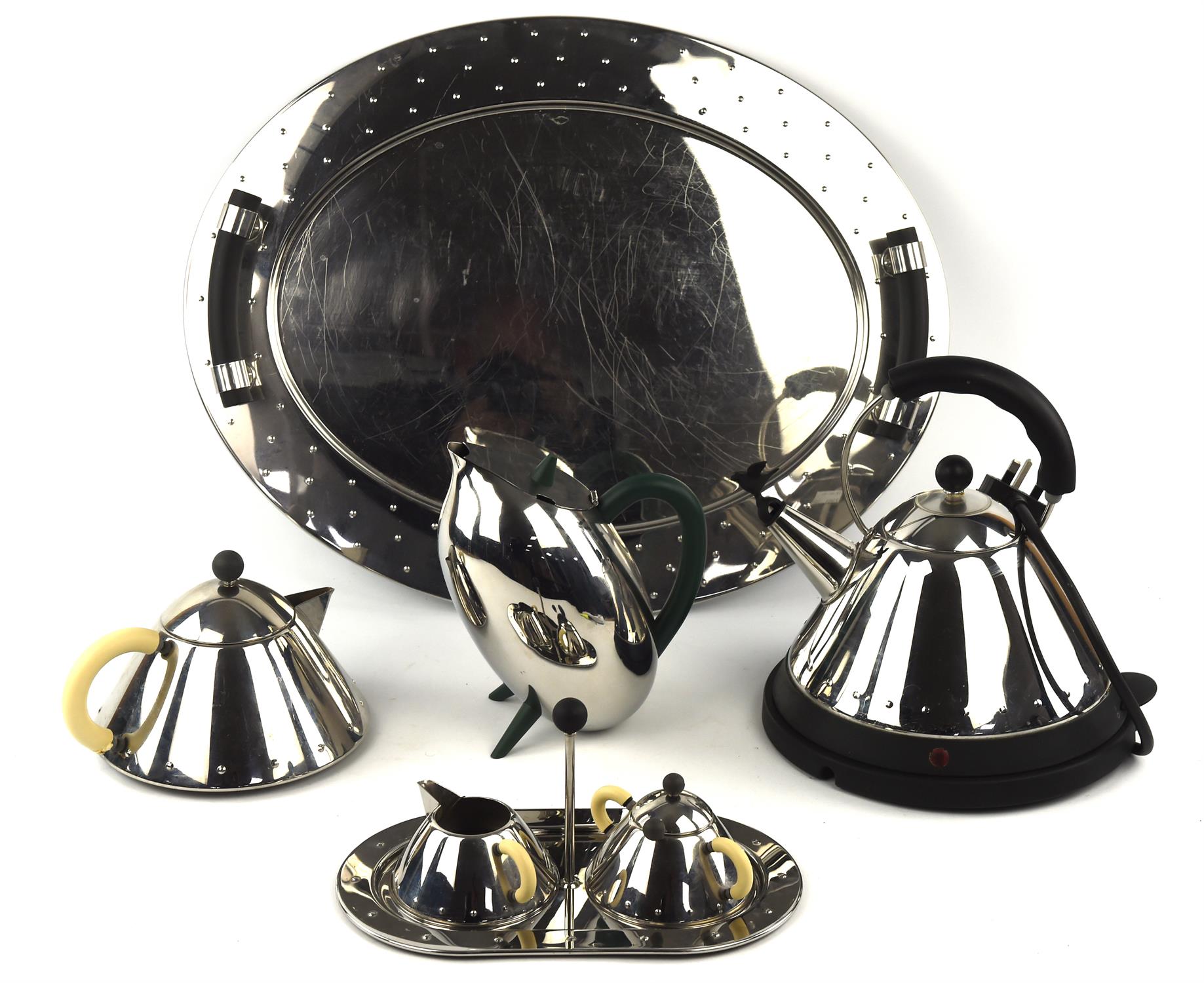 Michael Graves for Alessi, a chrome tea pot, together with matching cream jug, sugar basin on a