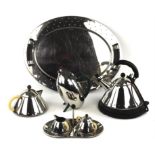 Michael Graves for Alessi, a chrome tea pot, together with matching cream jug, sugar basin on a