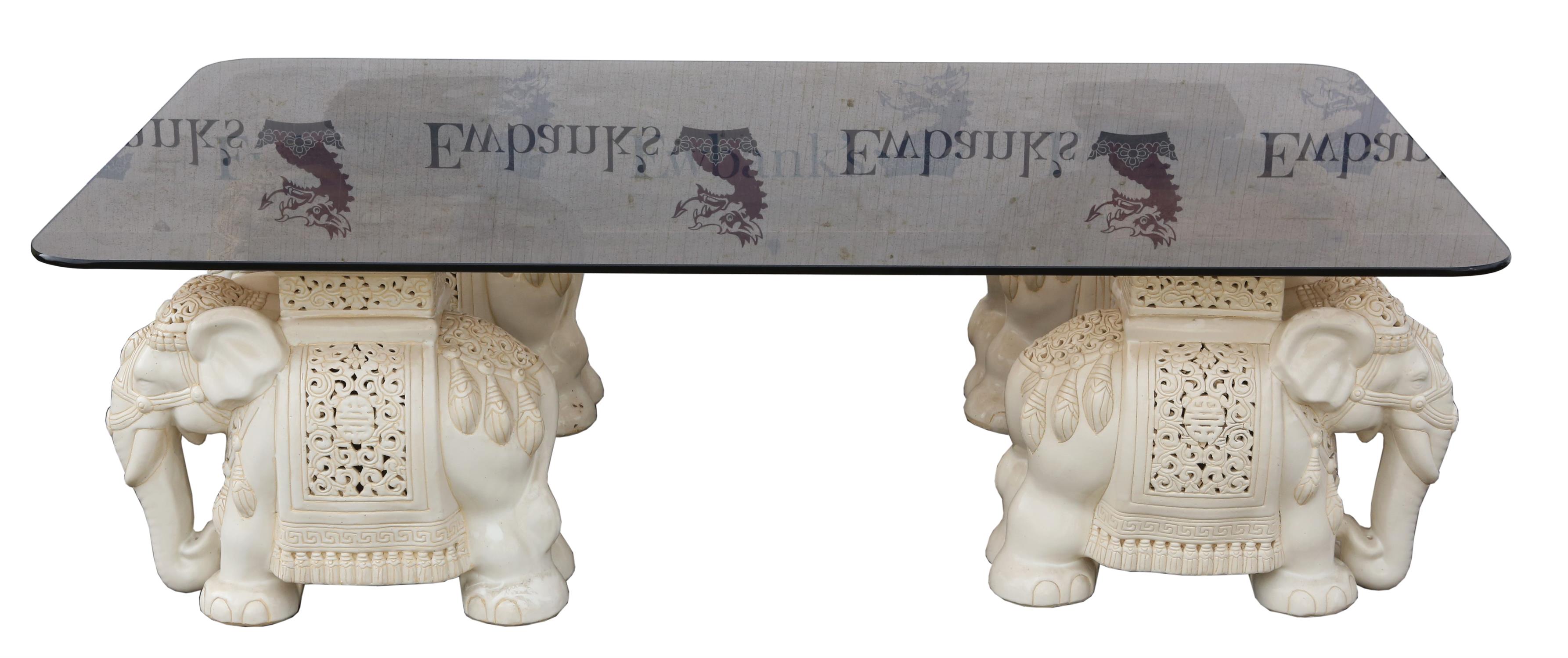 Unknown Designer, glass and ceramic coffee table, the supports in the form of elephants,
