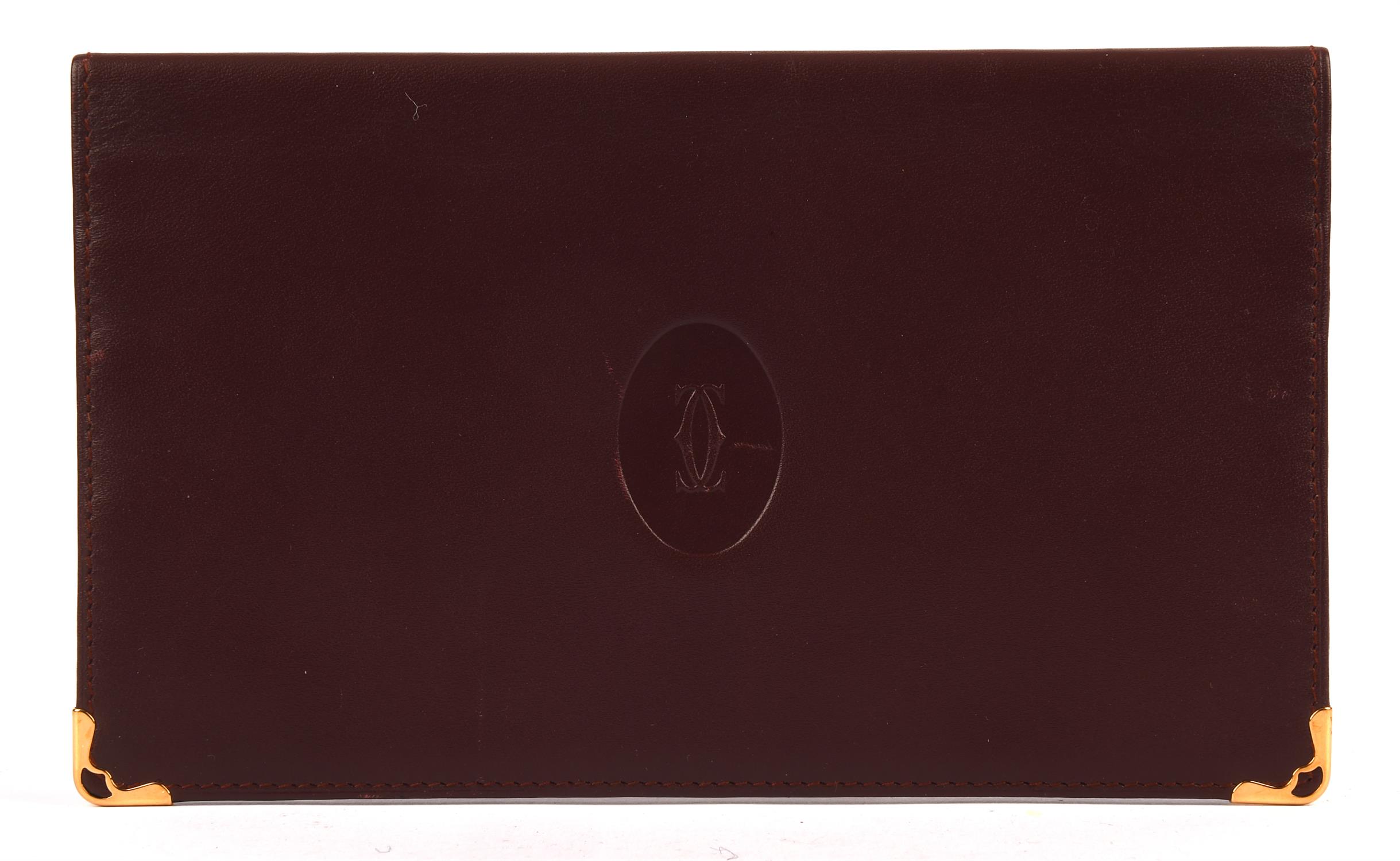 CARTIER burgundy bifold coat wallet with gold coloured hardware unused and unboxed (8cm x11cm)