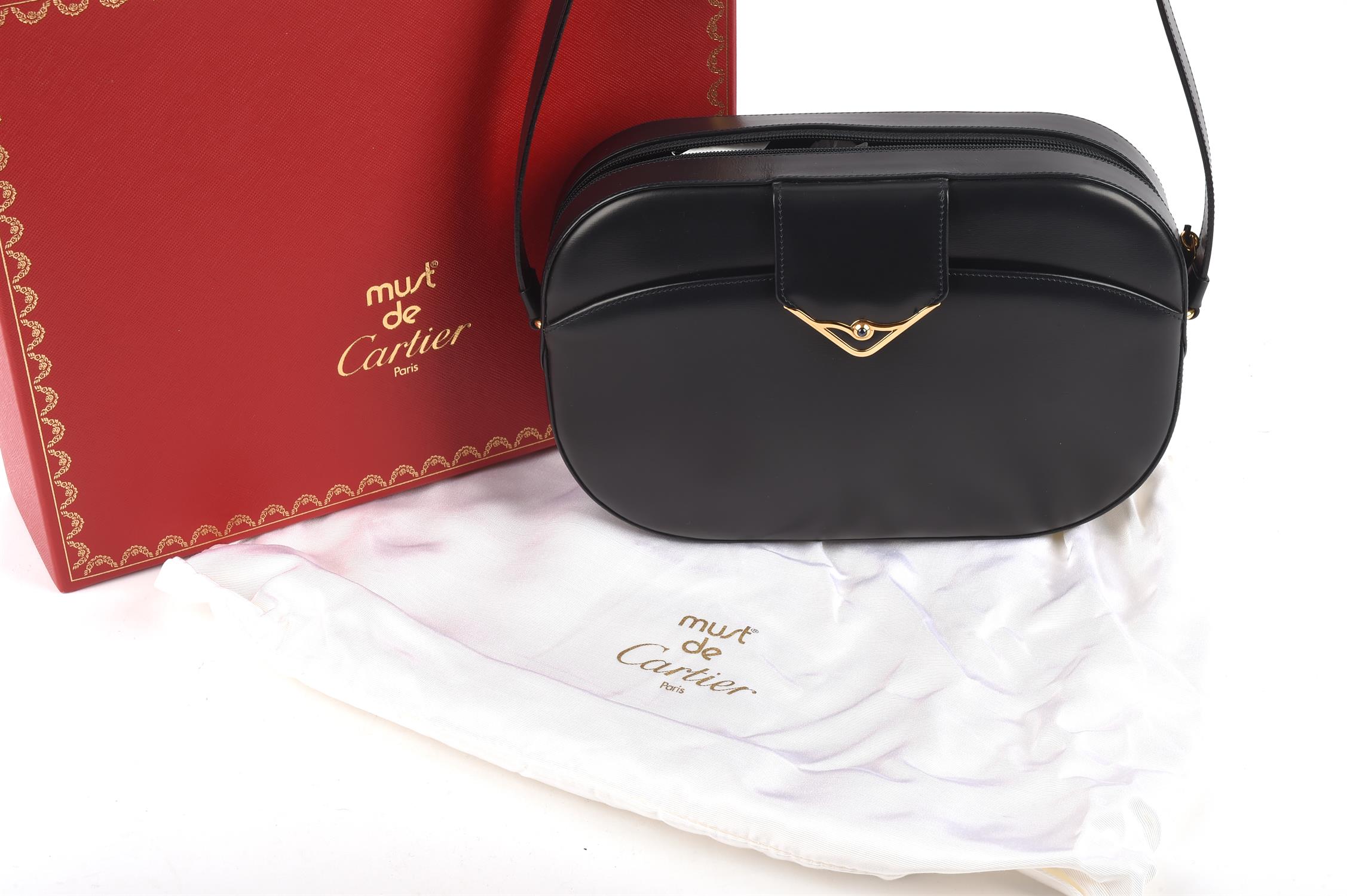 ADDENDUM DESCRIPTION * CARTIER MUST DE CARTIER boxed navy leather cross-body handbag and gold - Image 2 of 12