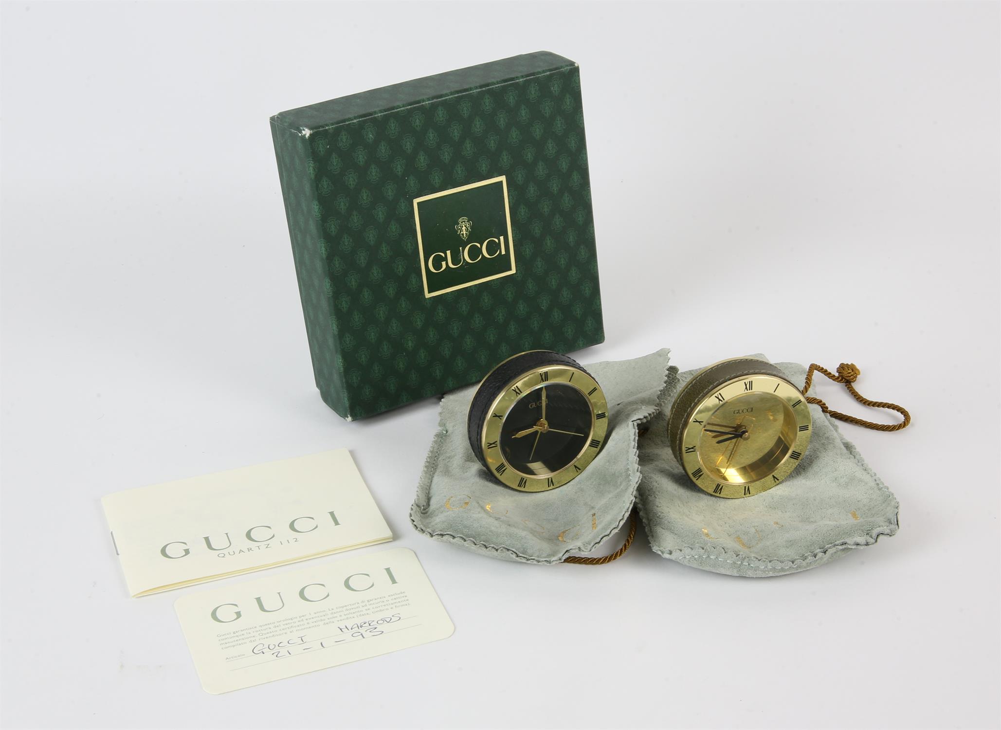 GUCCI two boxed his and hers leather-bound world travel/desk clocks in original kid leather pouches