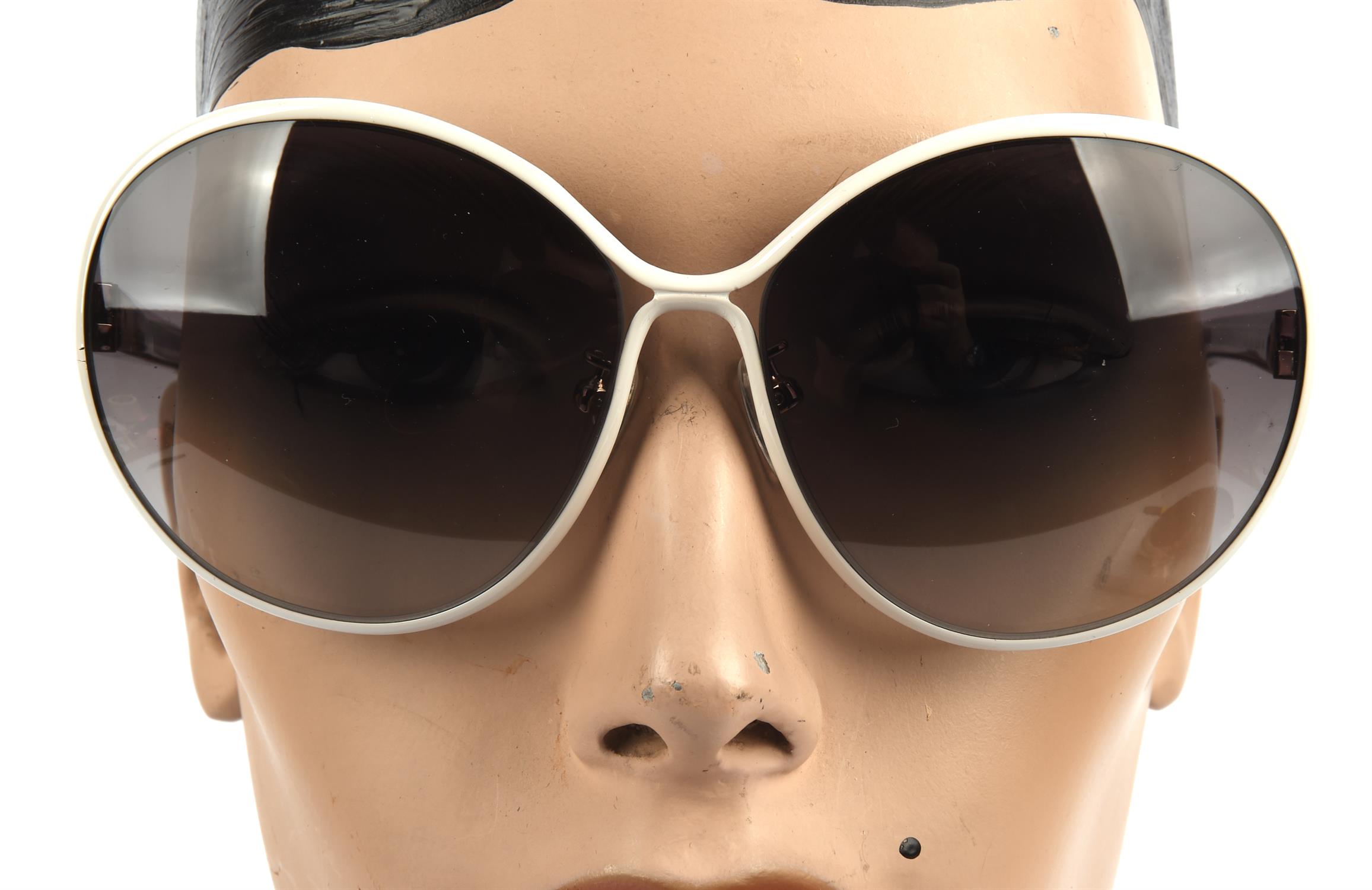 NINA RICCI a pair of ladies sunglasses in a black zipped case