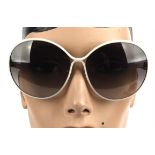 NINA RICCI a pair of ladies sunglasses in a black zipped case