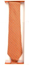 HERMES boxed orange silk tie