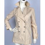 LOUIS VUITTON A ladies buff coloured short coat with chartreuse coloured lining UK8