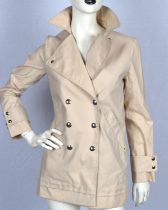 LOUIS VUITTON A ladies buff coloured short coat with chartreuse coloured lining UK8