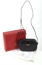 ADDENDUM DESCRIPTION * CARTIER MUST DE CARTIER boxed navy leather cross-body handbag and gold