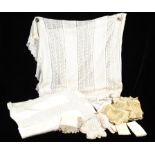 Two Edwardian large cotton lacework bedcovers and approximately 20 pieces of lace in the form of