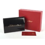 CARTIER MUST DE CARTIER boxed black smooth leather purse with six card sections and zipped
