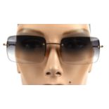 GUCCI a pair of ladies sunglasses in a TOM FORD cream case