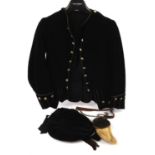 Edwardian child's formal Highland costume consisting of a black velvet jacket with silver-tone