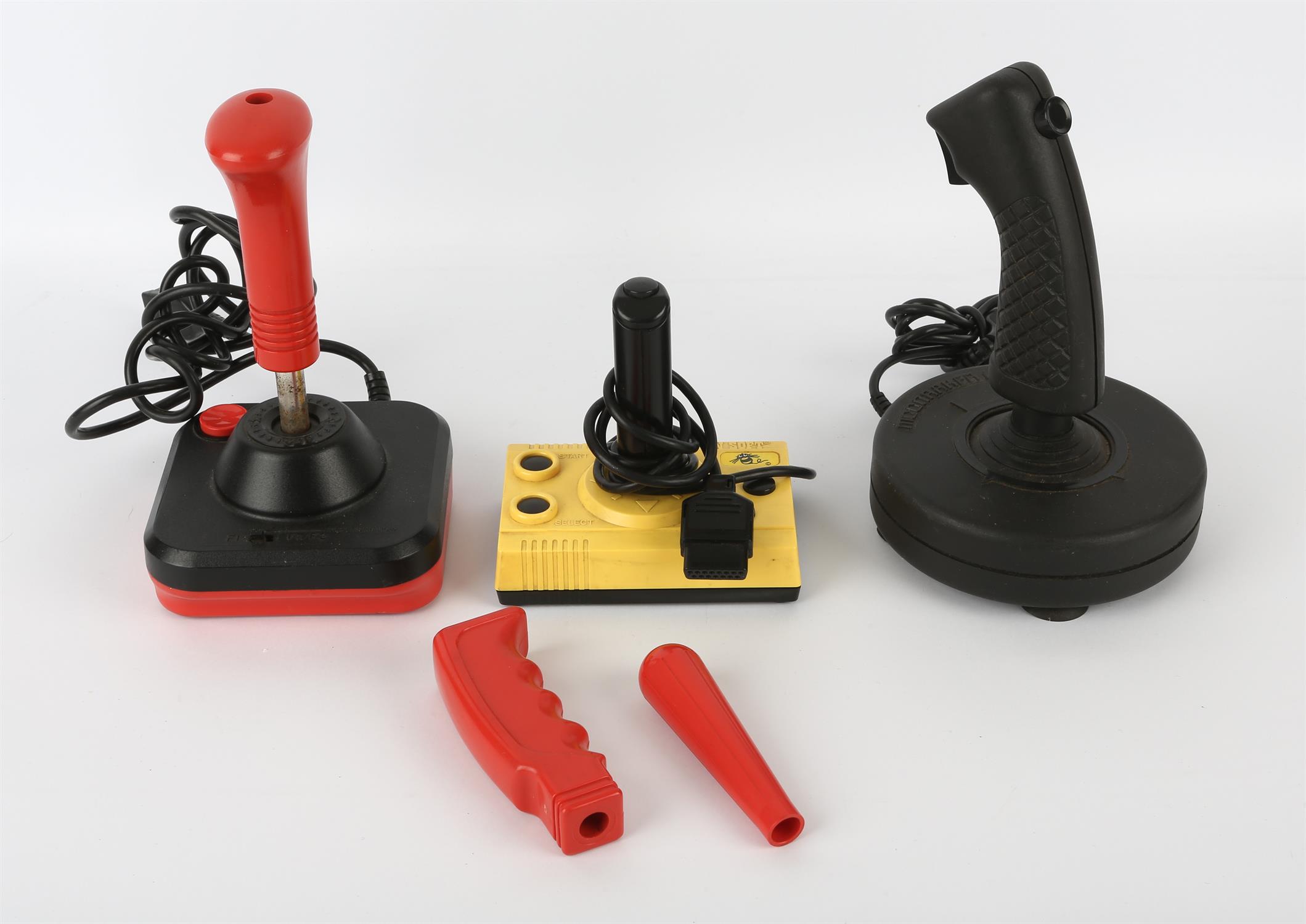 An assortment of 1980s joysticks Includes: Wico Command Control joystick (with 3 alternate