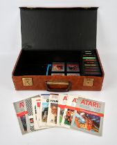 An assortment of 14 loose Atari games, with their corresponding manuals All items come in a brown