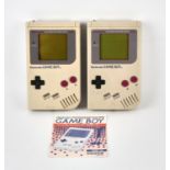 Nintendo Game Boy original console (x2) with 1 set of instructions Both consoles are unboxed and