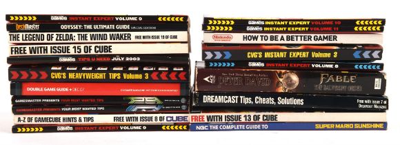 A large assortment of video game cheat books and guides from the 2000s