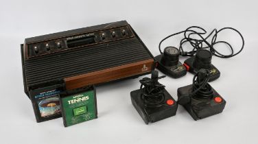 Atari 2600 console with 2 paddles, 2 classic joysticks and 2 loose games Games include: Space