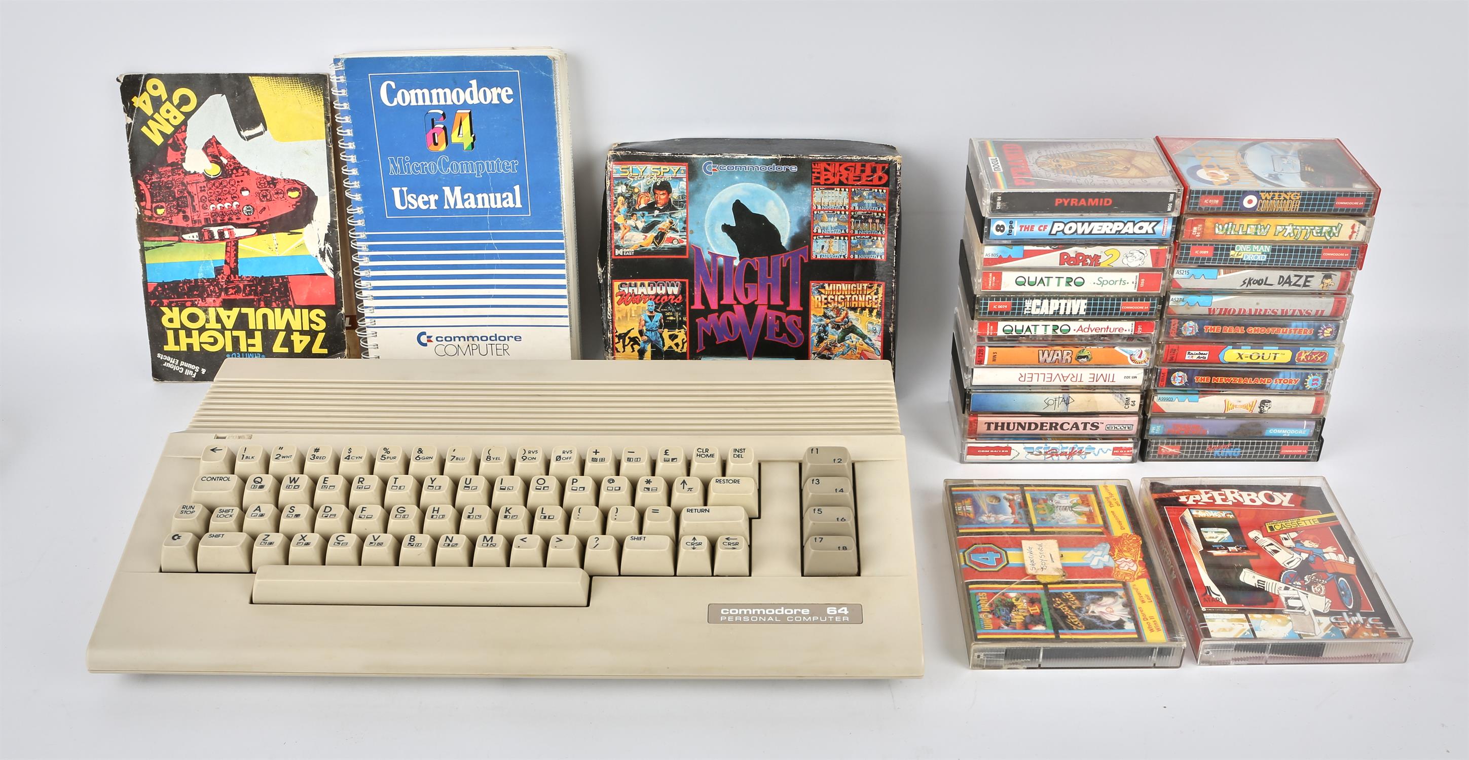 A Commodore 64 C64C computer with power supply/transformer, original instructions and 25 boxed