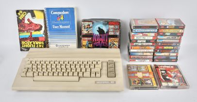 A Commodore 64 C64C computer with power supply/transformer, original instructions and 25 boxed