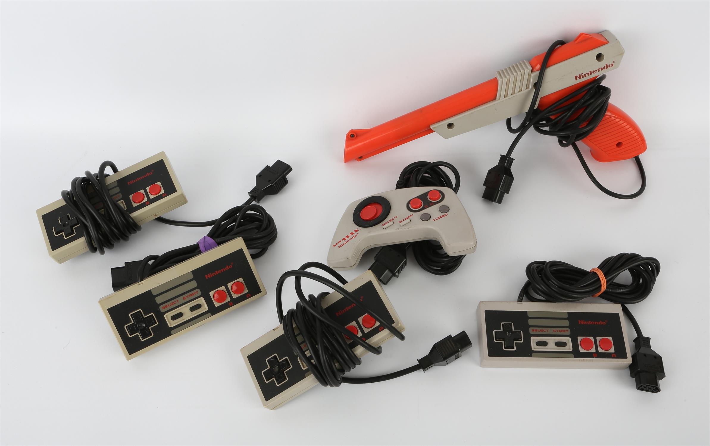 An assortment of Nintendo Entertainment System spares, peripherals and accessories Includes: