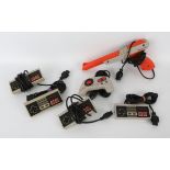 An assortment of Nintendo Entertainment System spares, peripherals and accessories Includes: