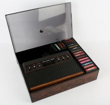 Atari CX 2600 console in a third-party storage case with cover, power supply and 19 games Games