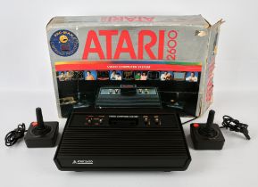 Atari 2600 Darth Vader variant console, with power plug and 2 official Joysticks Console is boxed,