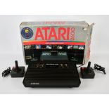 Atari 2600 Darth Vader variant console, with power plug and 2 official Joysticks Console is boxed,