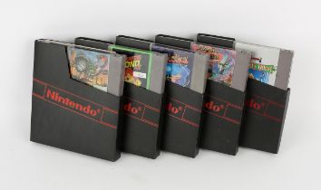 An assortment of 5 loose Nintendo Entertainment System (NES) cartridges Games include: Solstice,
