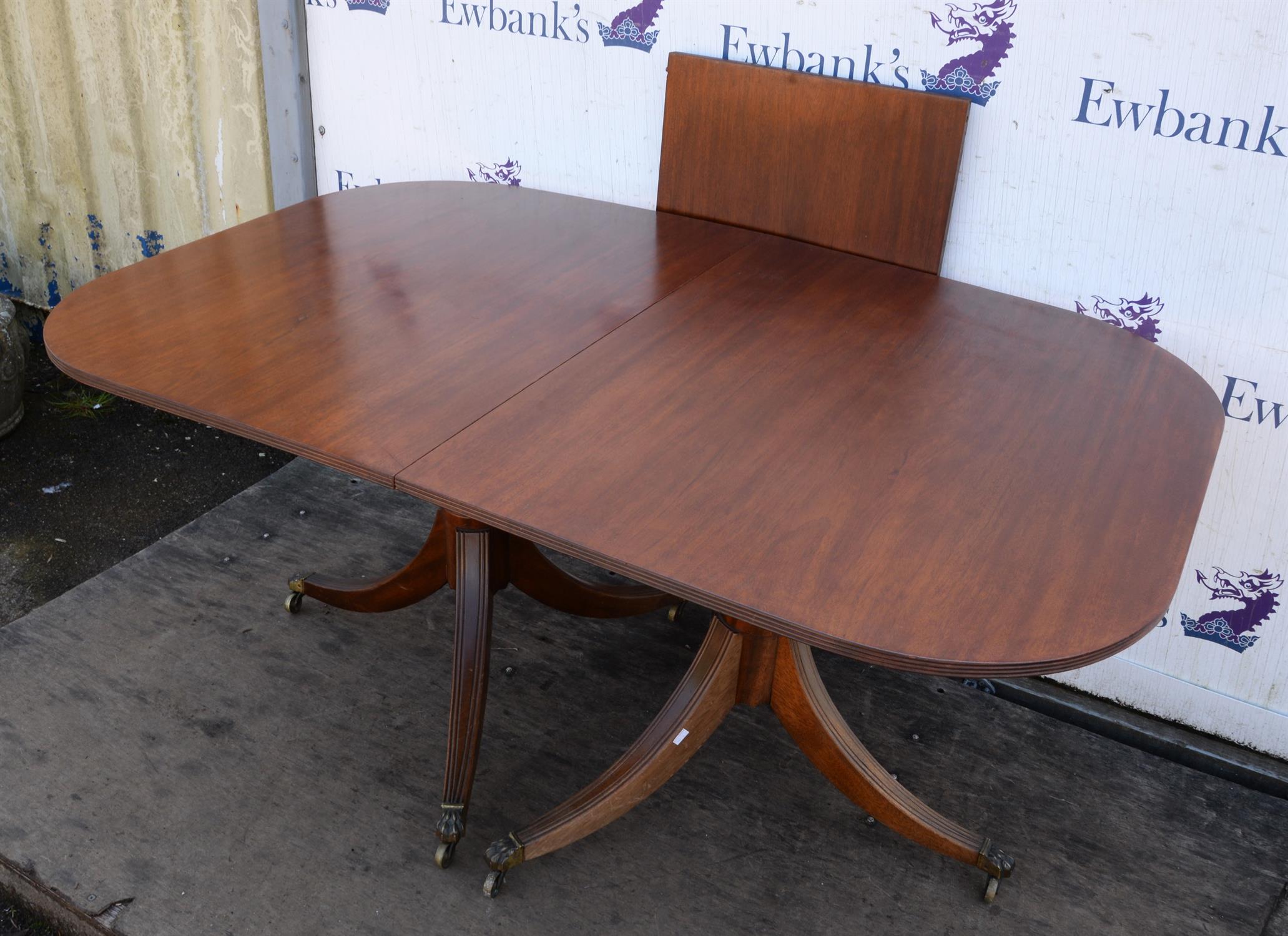 A Regency style mahogany dining table, the top George III, the rounded ends on turned bases with - Image 2 of 3