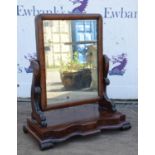 A Victorian mahogany toilet mirror, 1840s, with a shaped base and scroll supports, H 63cm, W 54cm,