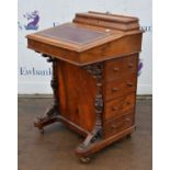 A Victorian walnut davenport, the upper hinged compartment now void, H 81cm, W 53cm, D 53cm