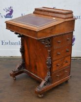 A Victorian walnut davenport, the upper hinged compartment now void, H 81cm, W 53cm, D 53cm