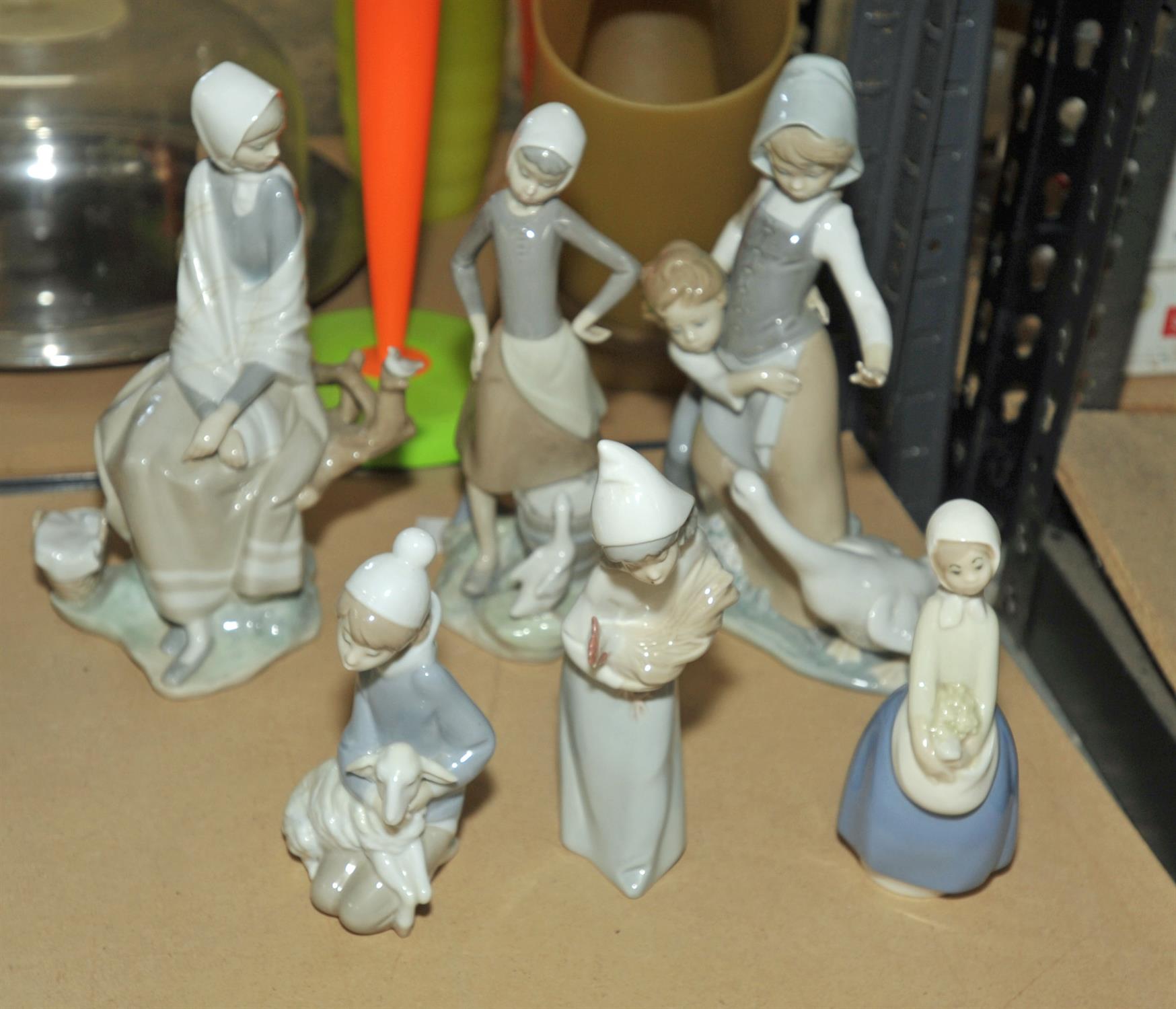 Seven Lladro porcelain figures of girls, in various attitudes, some with geese, lambs and flowers, - Image 2 of 2