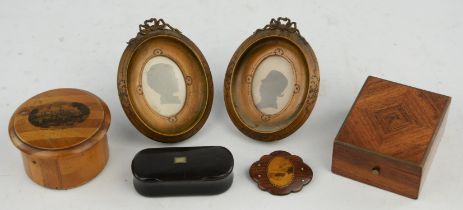 A pair of late 19th century French silhouettes housed in oval fruit wood frames, height 11cm,