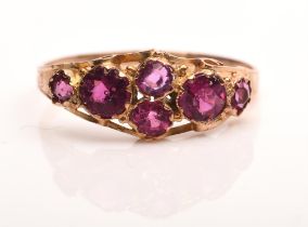 Antique cluster ring set with six round cut paste stones with an engraved shank in 9 ct, size N