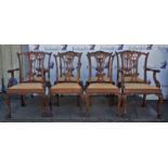 Eight George III style mahogany dining chairs, with two armchairs, the backs with pierced splats,