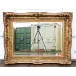 A gilt gesso picture frame, late 19th/early 20th Century, with foliate moulded decoration,