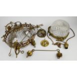 A late 19th century ceiling light of domed cut glass form enclosed by a brass circlet moulded with