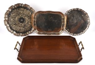 Three silver plated trays with a large wooden butlers tray