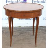 A Louis XVI style kingwood occasional table, late 19th century, the shaped top quarter veneered and
