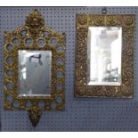 An Arts & Crafts style rectangular wall mirror with brass foliate embossed wide border, height 43cm,