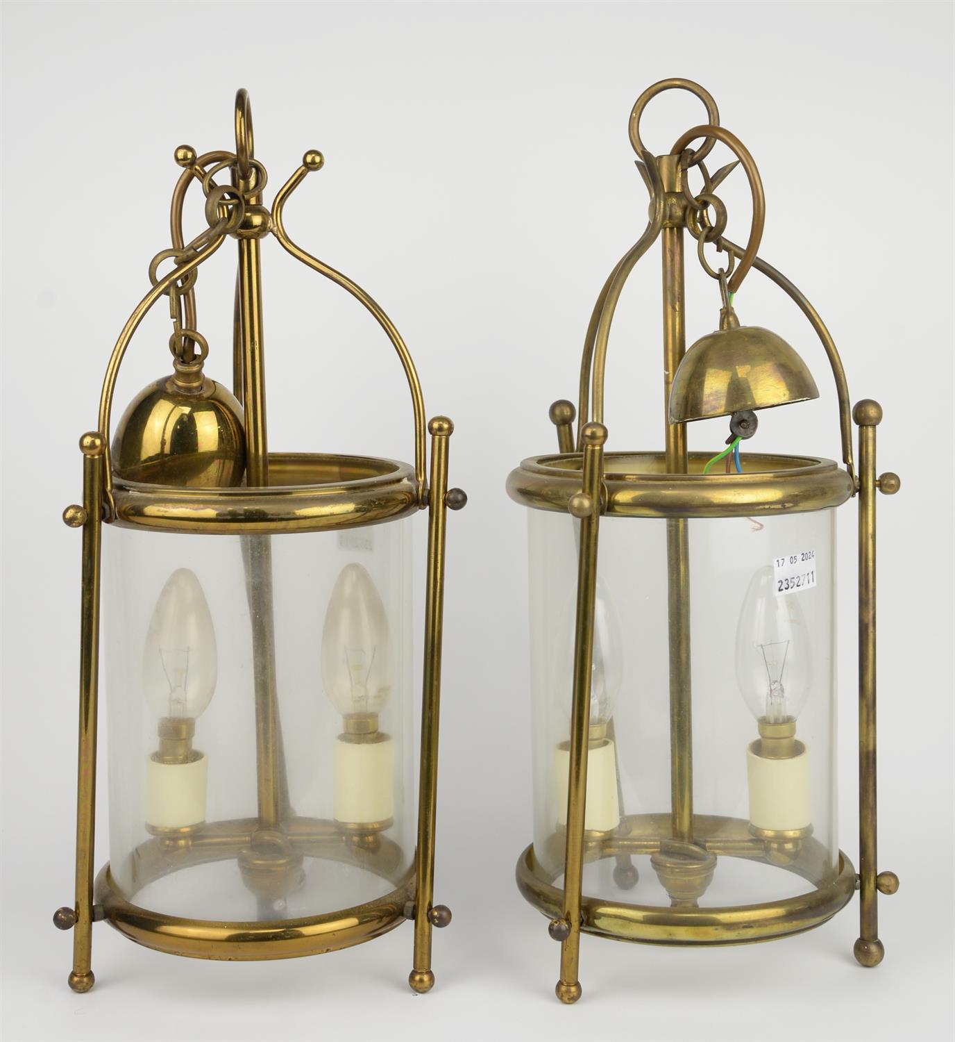 A pair of 20th century gilt brass hall lanterns of cylindrical form, each enclosing a twin light