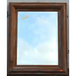 A William and Mary style limed pine cushion frame mirror, late 20th century, with bevelled plate,