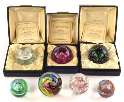 Three Caithness glass paperweights ; 'Morning Dew', 'Flower in the Rain' and 'May Dance',