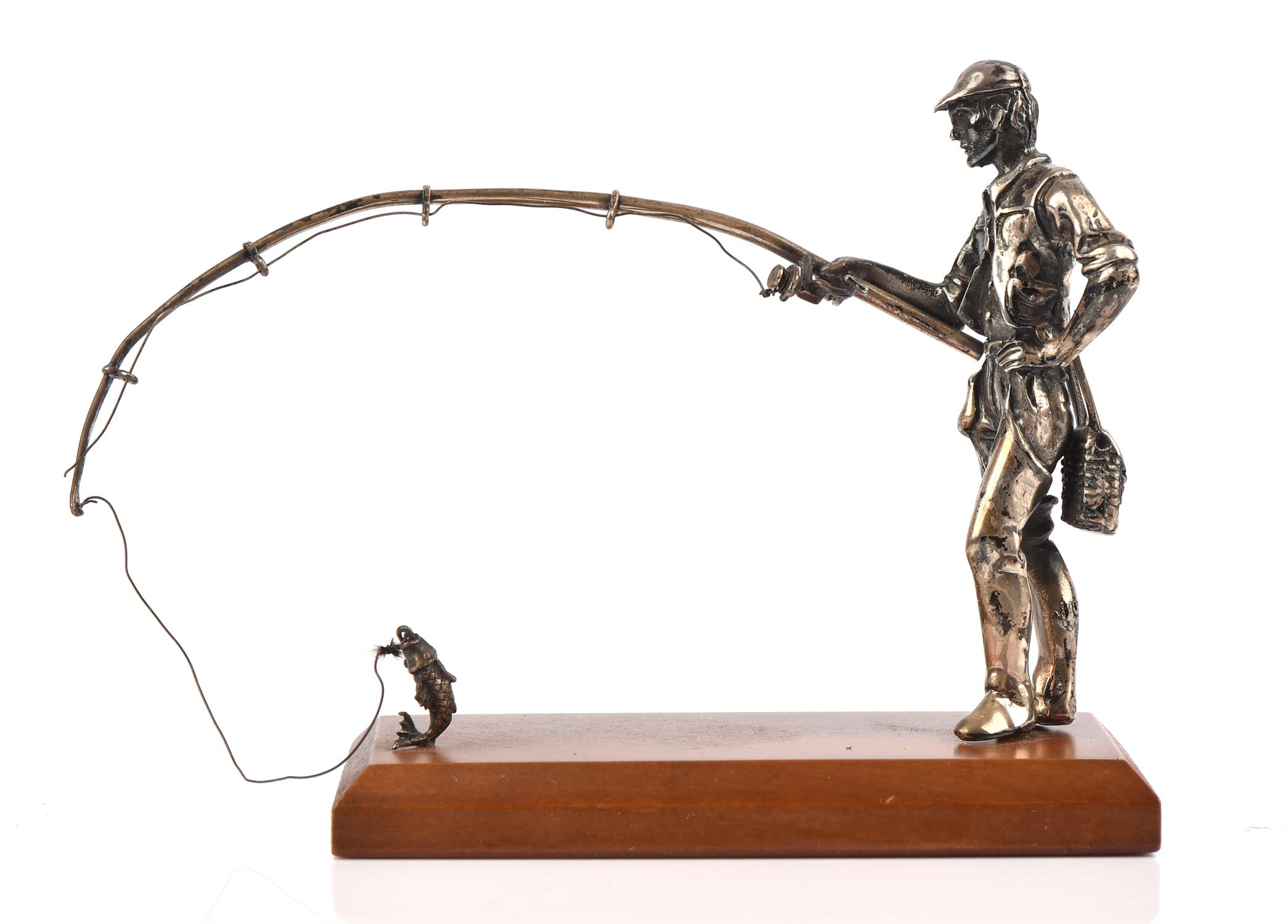 Cast silver figure of a fisherman holding a rod with fish on line by M & SJ import, London, 1860