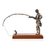 Cast silver figure of a fisherman holding a rod with fish on line by M & SJ import, London, 1860